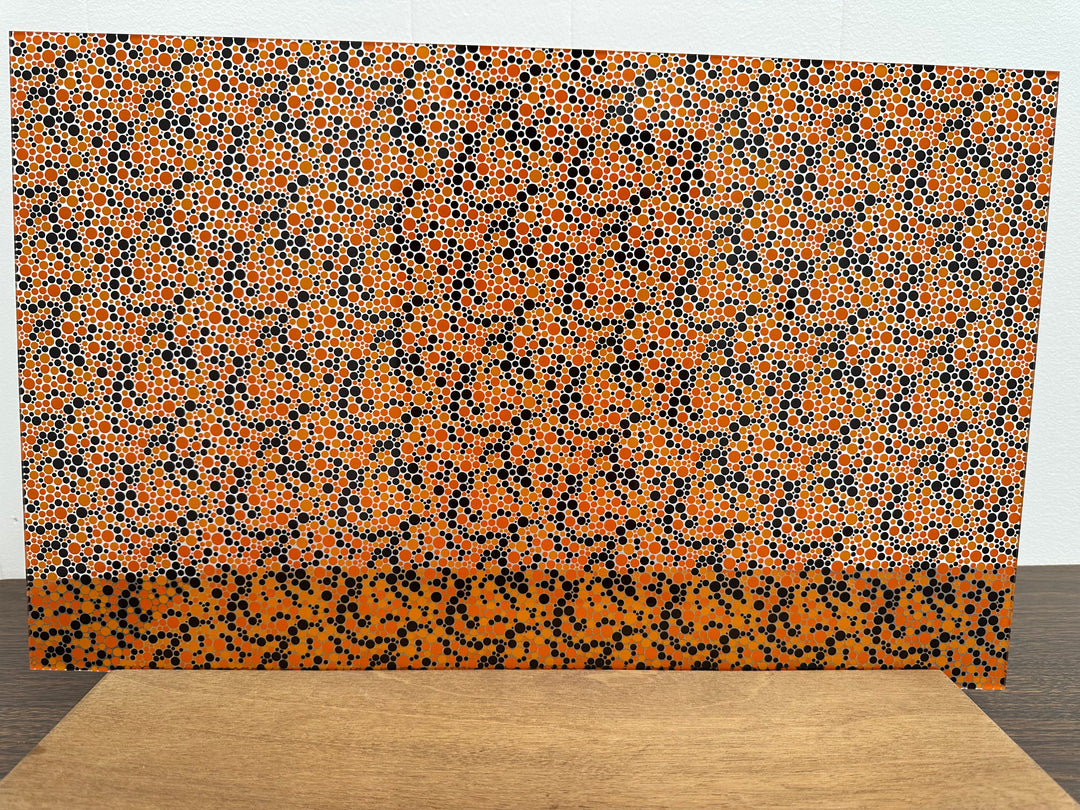 PatternPly® Scattered Orange and Black Bubbles