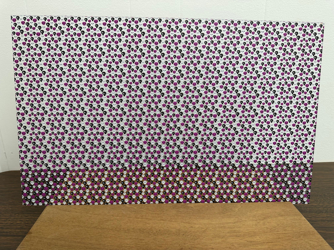 PatternPly® Scattered Purple, Black, and White Skulls