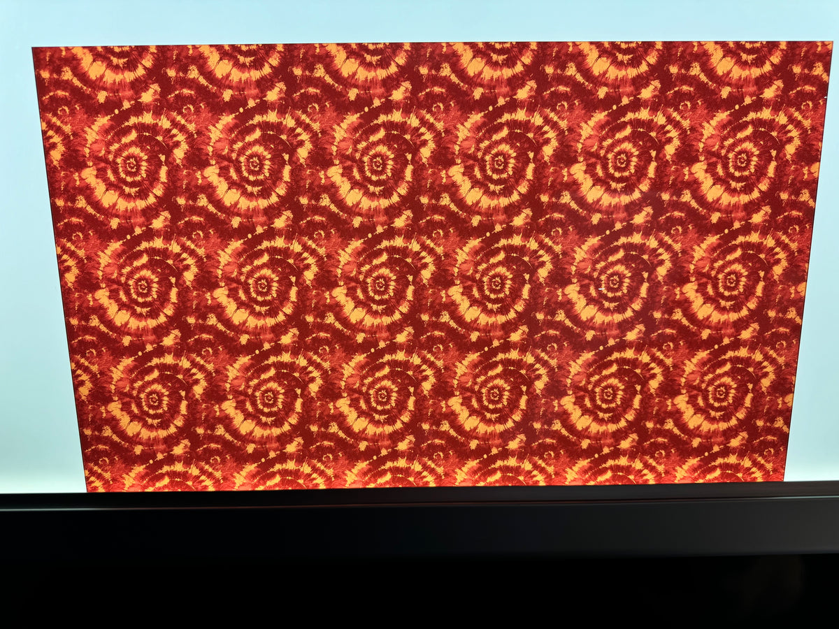 PatternPly® Transparent Maroon and Orange Tie Dye sheet showing the pattern
