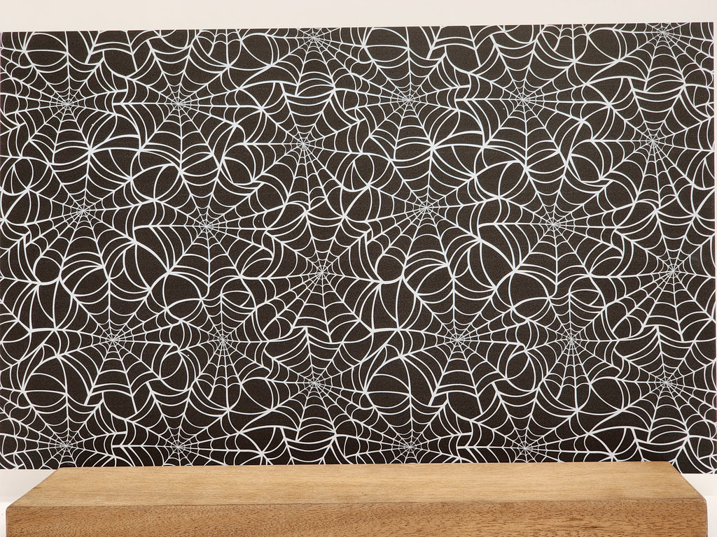 PatternPly® Full Coverage Large White Spiderwebs on Black Background sheet showing the pattern
