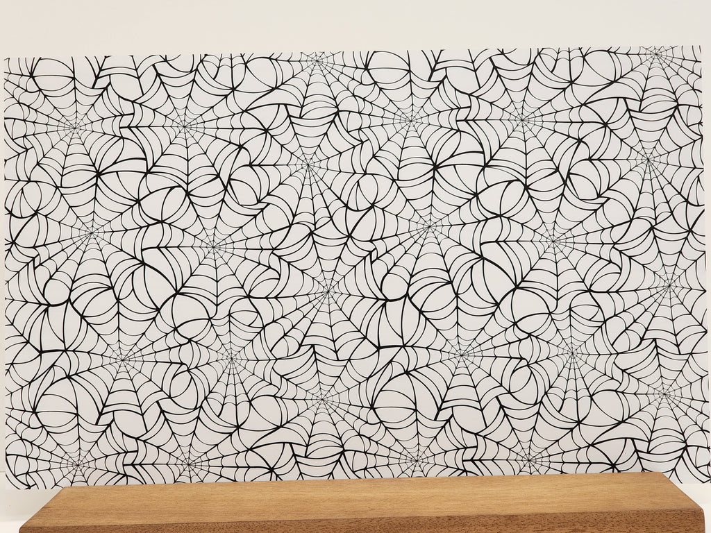 PatternPly® Full Coverage Large Black Spiderwebs on White Background sheet showing the pattern