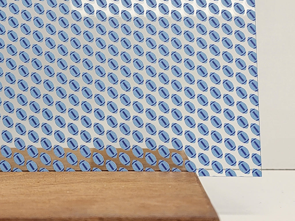 PatternPly® Scattered Light and Dark Blue Footballs sheet showing the pattern