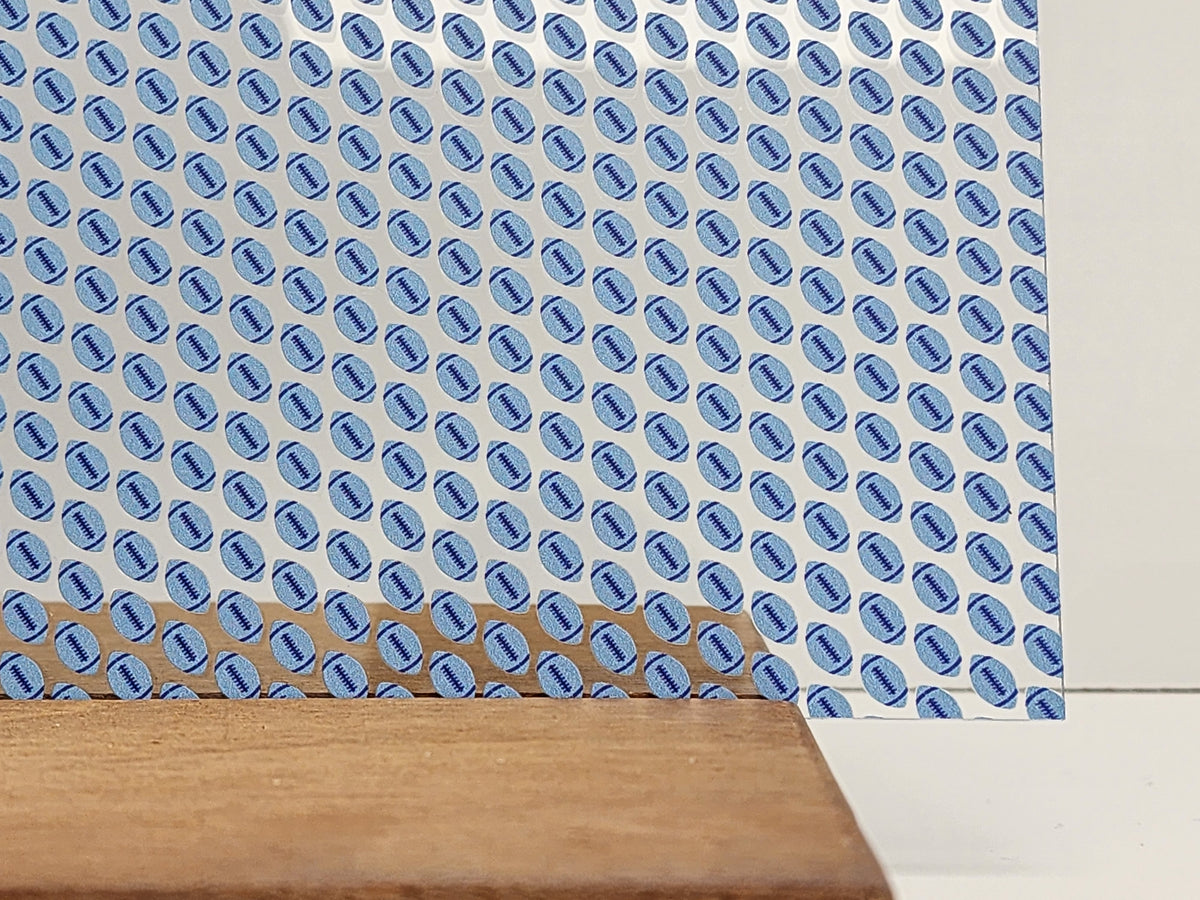 PatternPly® Scattered Light and Dark Blue Footballs sheet showing the pattern
