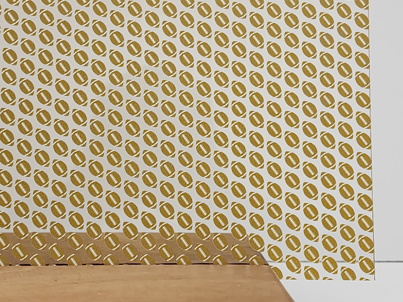 PatternPly® Scattered Gold and White Footballs