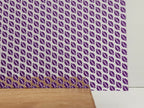 PatternPly® Scattered Purple and White Footballs sheet showing the pattern