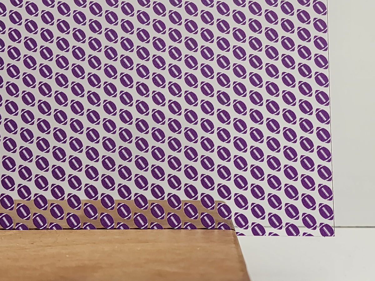 PatternPly® Scattered Purple and White Footballs sheet showing the pattern