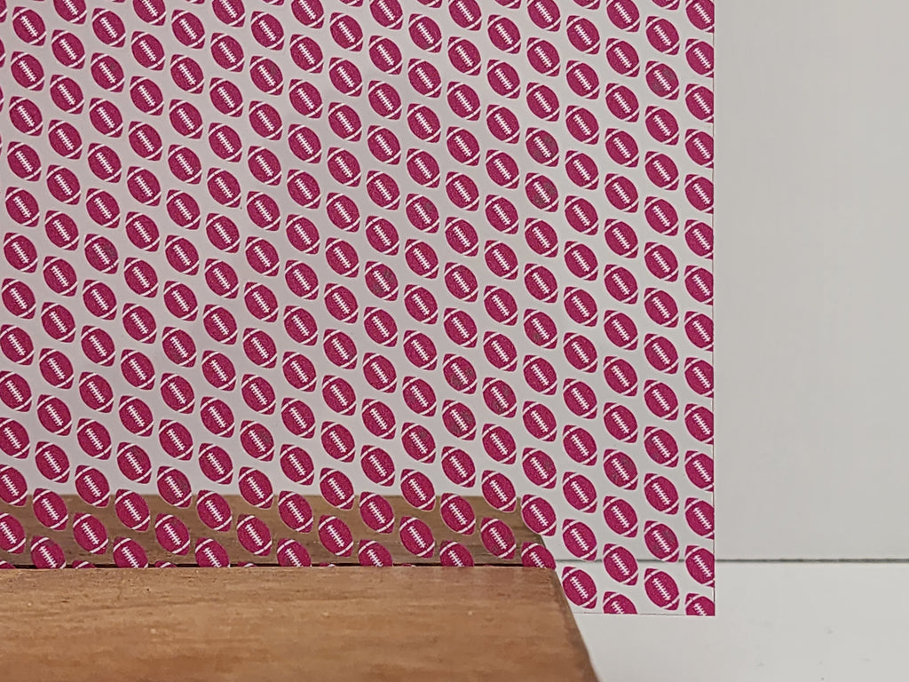 PatternPly® Scattered Pink and White Footballs sheet showing the pattern