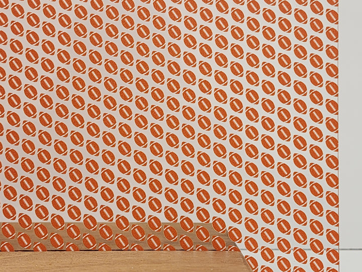 PatternPly® Scattered Orange and White Footballs