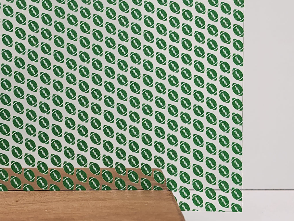 PatternPly® Scattered Green and White Footballs sheet showing the pattern
