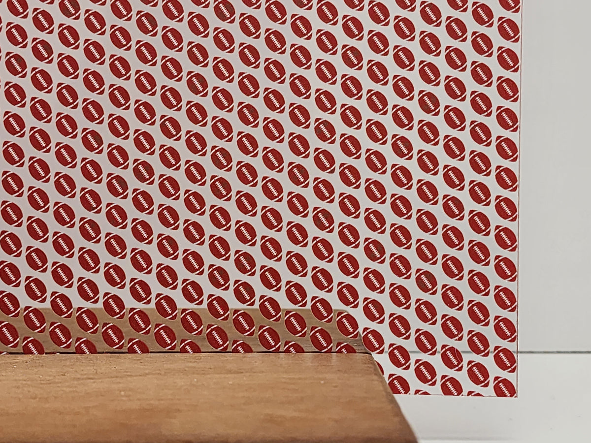 PatternPly® Scattered Red and White Footballs sheet showing the pattern