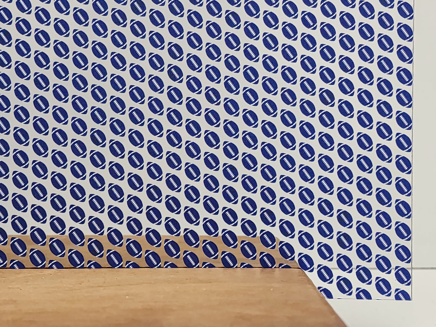 PatternPly® Scattered Blue and White Footballs