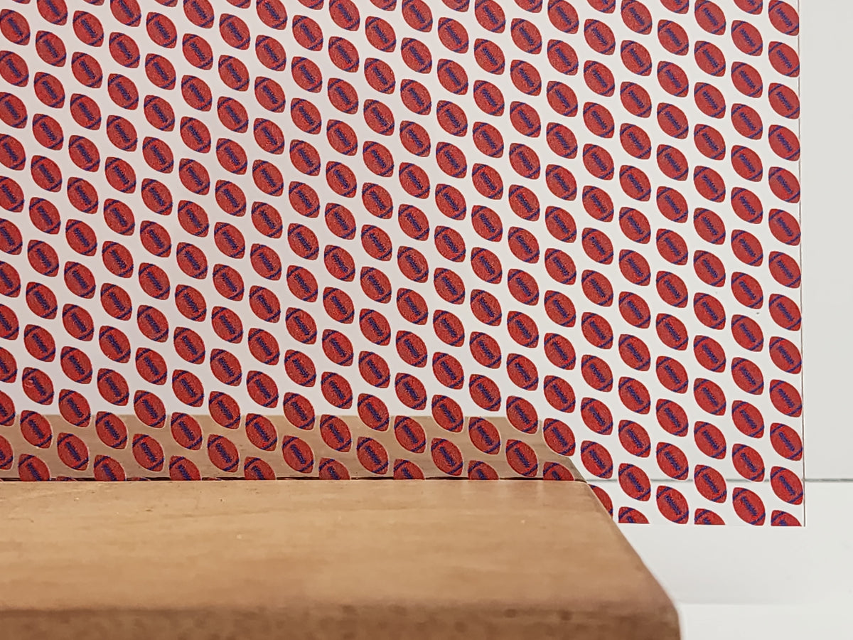 PatternPly® Scattered Red and Blue Footballs sheet showing the pattern