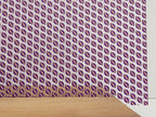 PatternPly® Scattered Purple and Yellow Footballs sheet showing the pattern