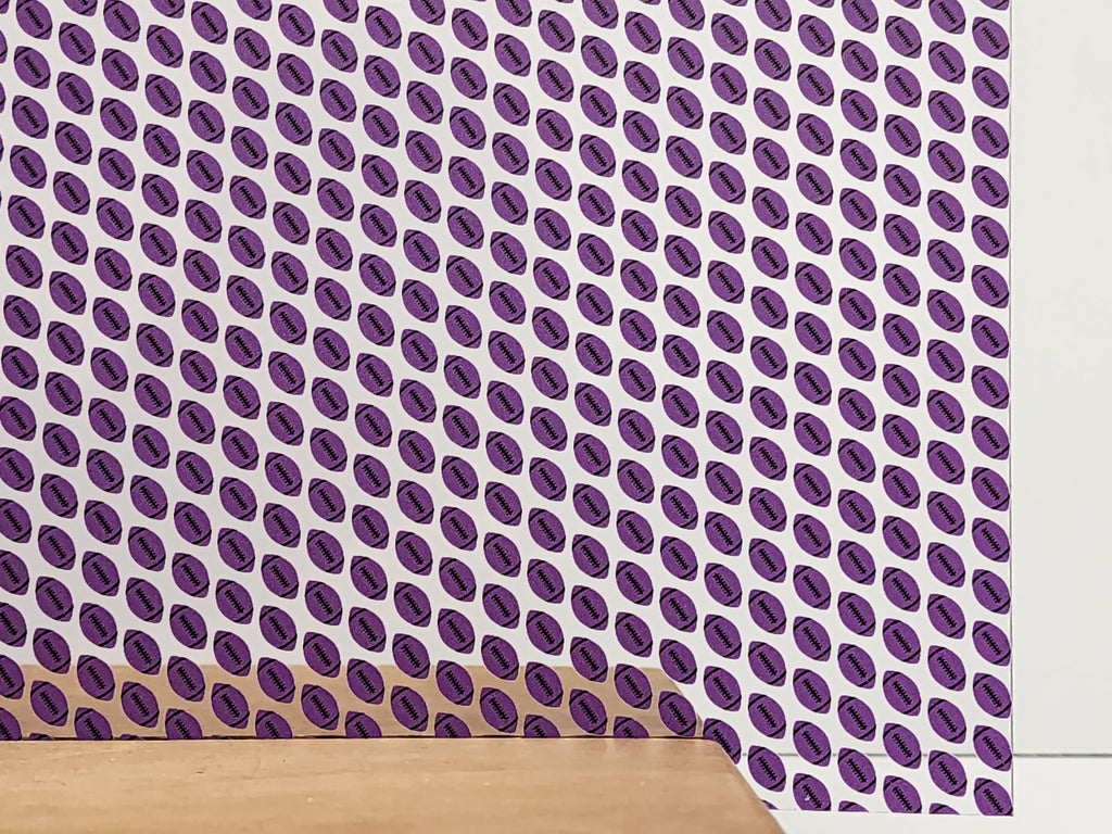 PatternPly® Scattered Purple and Black Footballs sheet showing the pattern