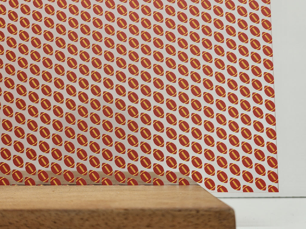 PatternPly® Scattered Red and Yellow Footballs sheet showing the pattern