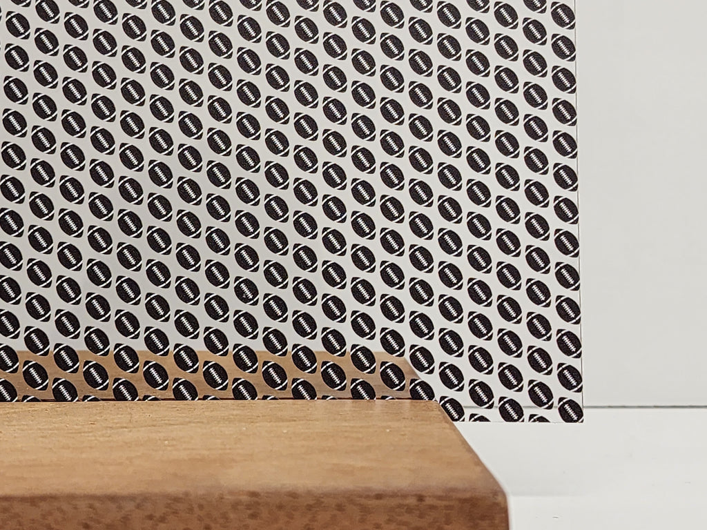PatternPly® Scattered Black Footballs sheet showing the pattern