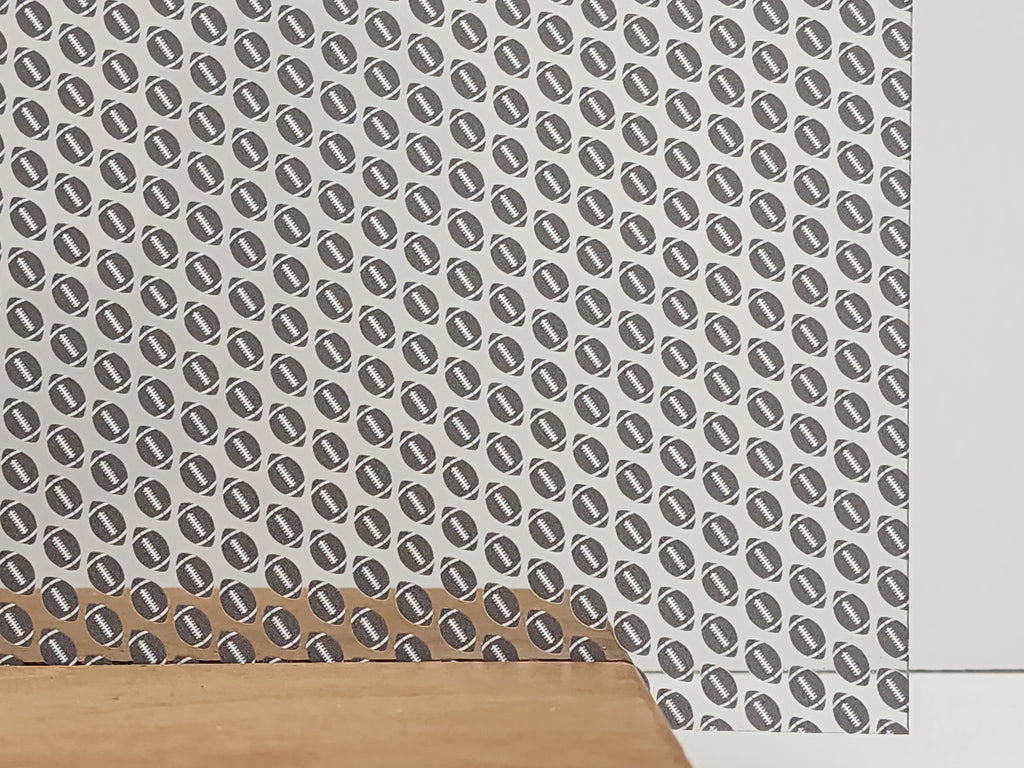 PatternPly® Scattered Gray and White Footballs sheet showing the pattern