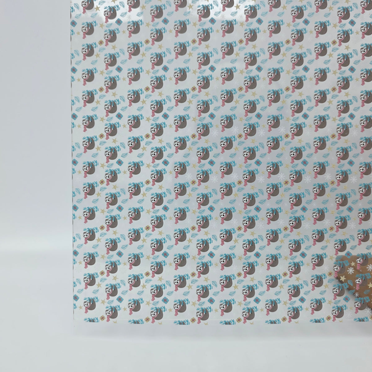 PatternPly® Scattered Christmas Sloths sheet showing the pattern