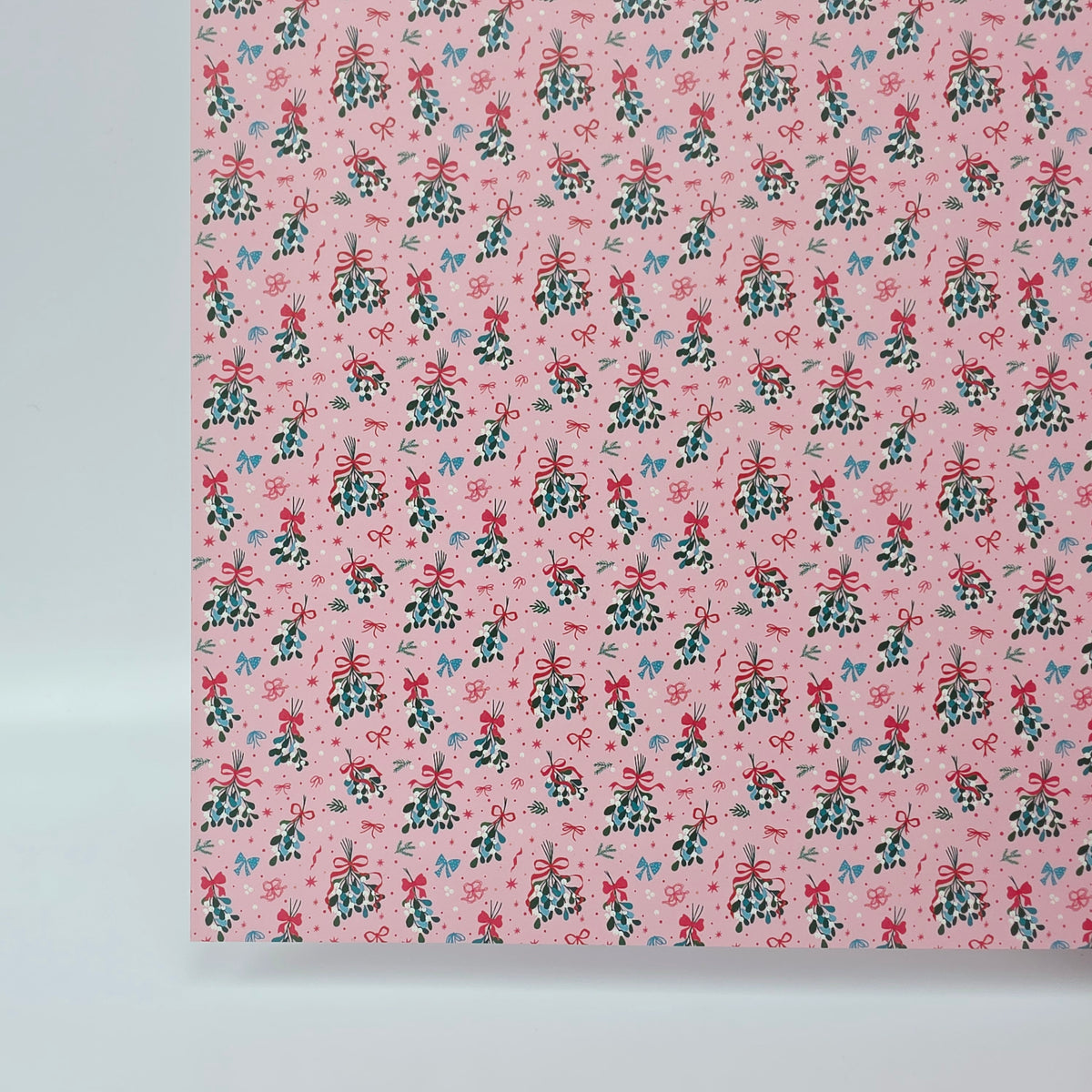 PatternPly® Full Coverage Mistletoe and Bows on Pink sheet showing the pattern