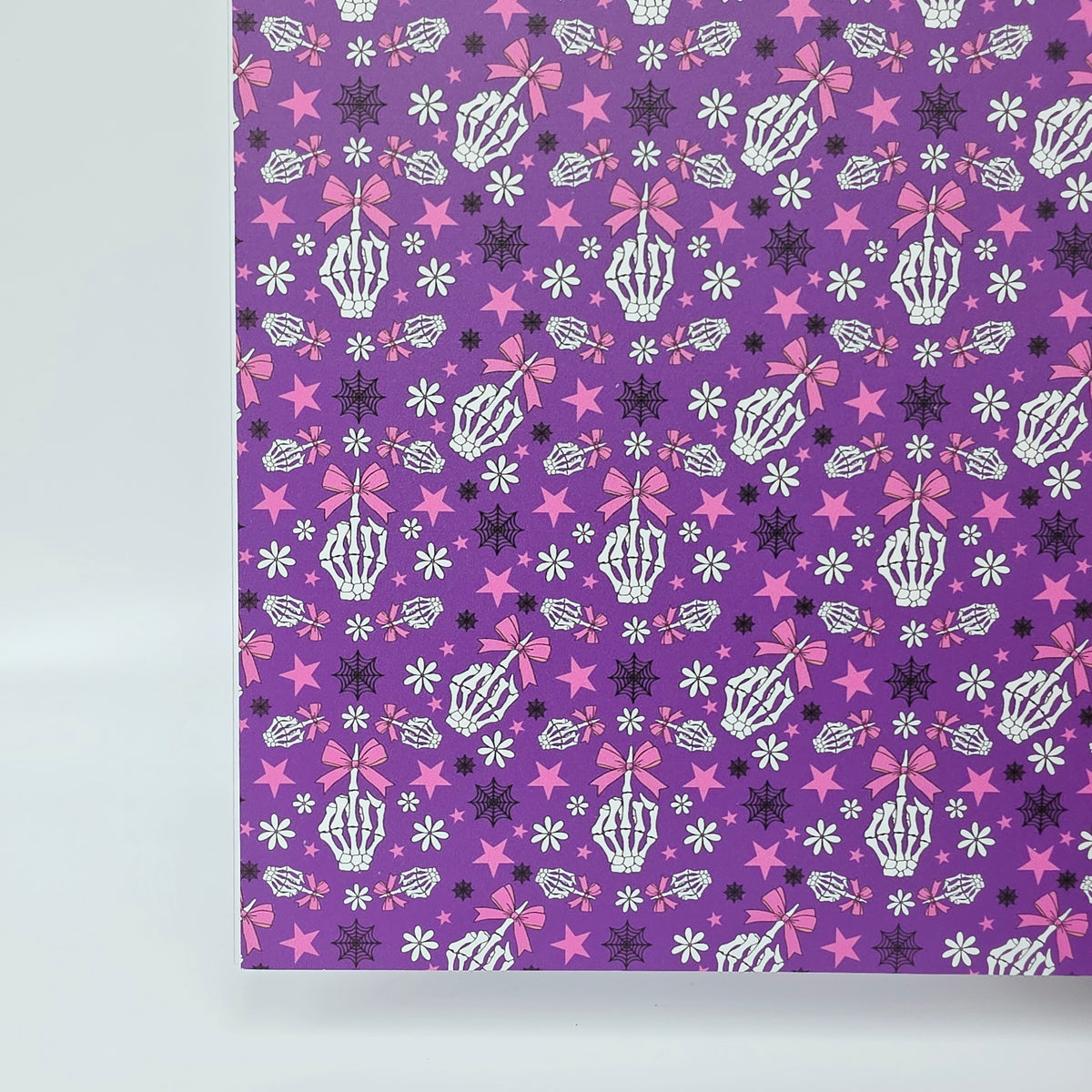 PatternPly® Full Coverage Fingers and Bows on Purple sheet showing the pattern