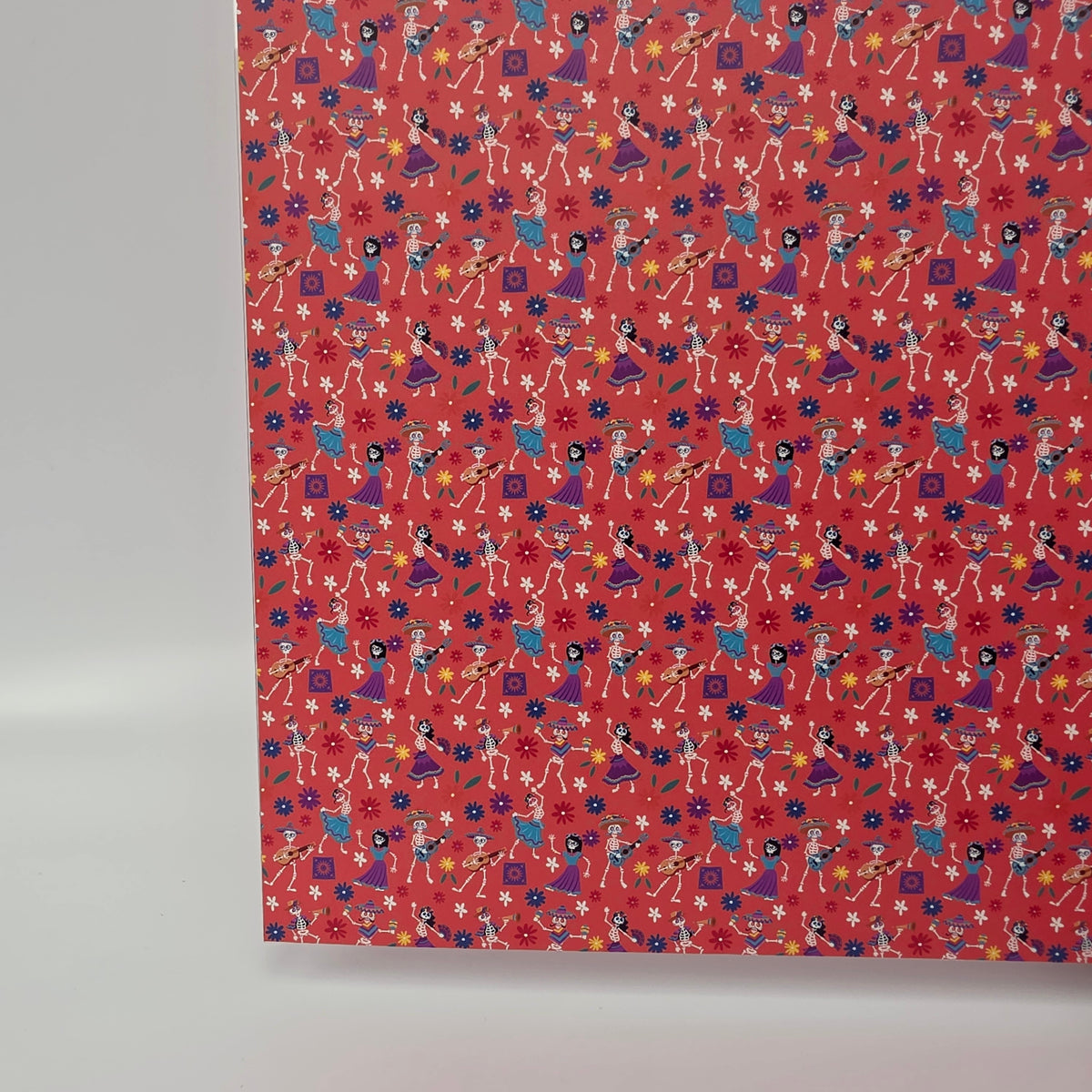 PatternPly® Full Coverage Skeleton Fiesta on Coral sheet showing the pattern