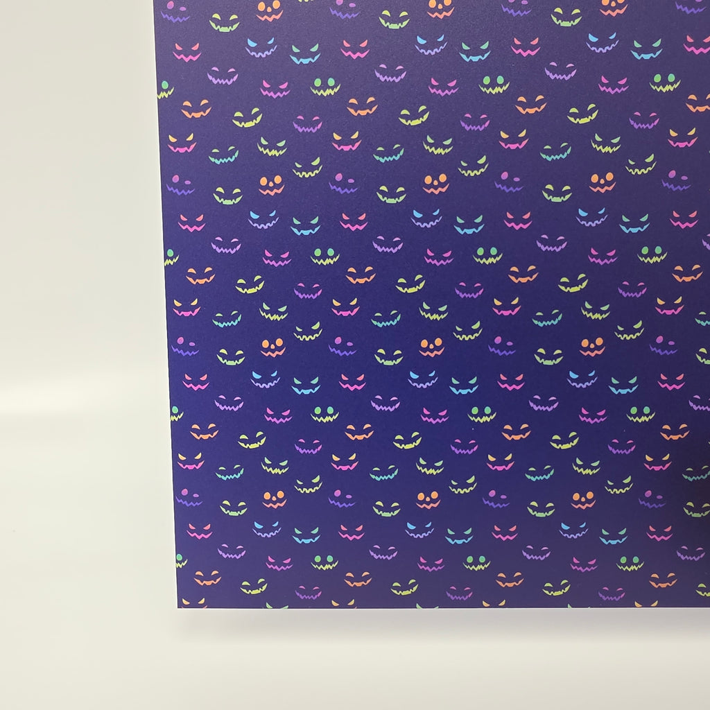 PatternPly® Transparent Neon Spooky Faces On Purple sheet showing the pattern