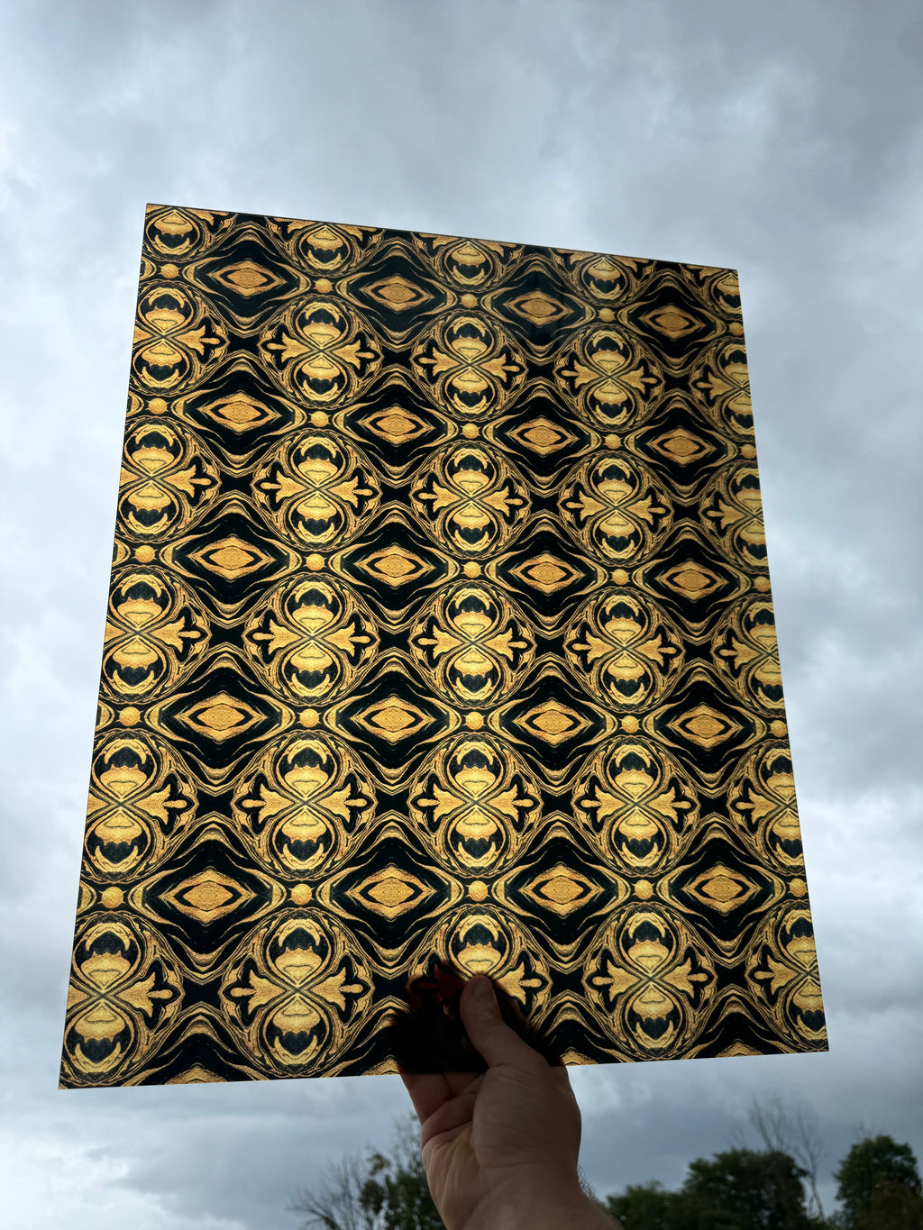 PatternPly® 19x24" Transparent Black and Gold Kaleidoscope XL Scale sheet showing the pattern