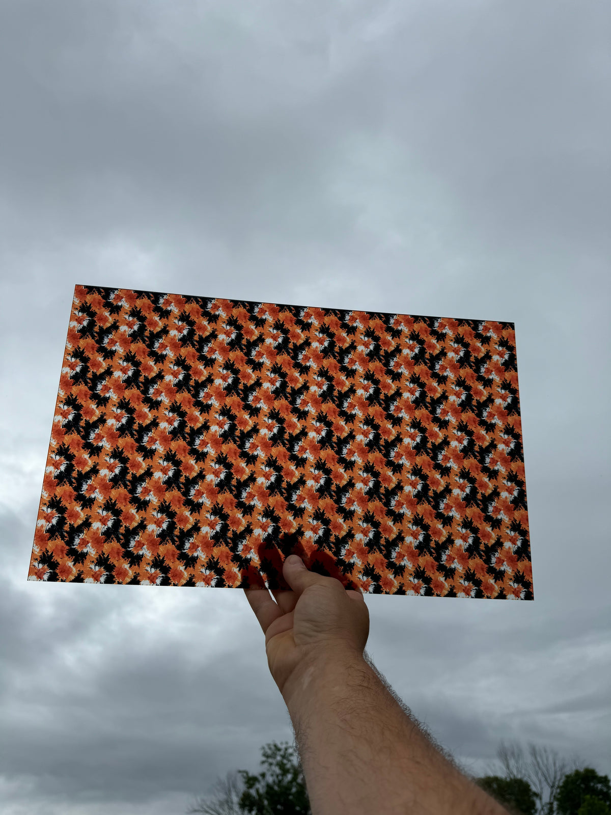 PatternPly® Transparent Orange and Black Halloween Tie Dye sheet showing the pattern