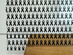 PatternPly® Scattered Black Ribbons sheet showing the pattern