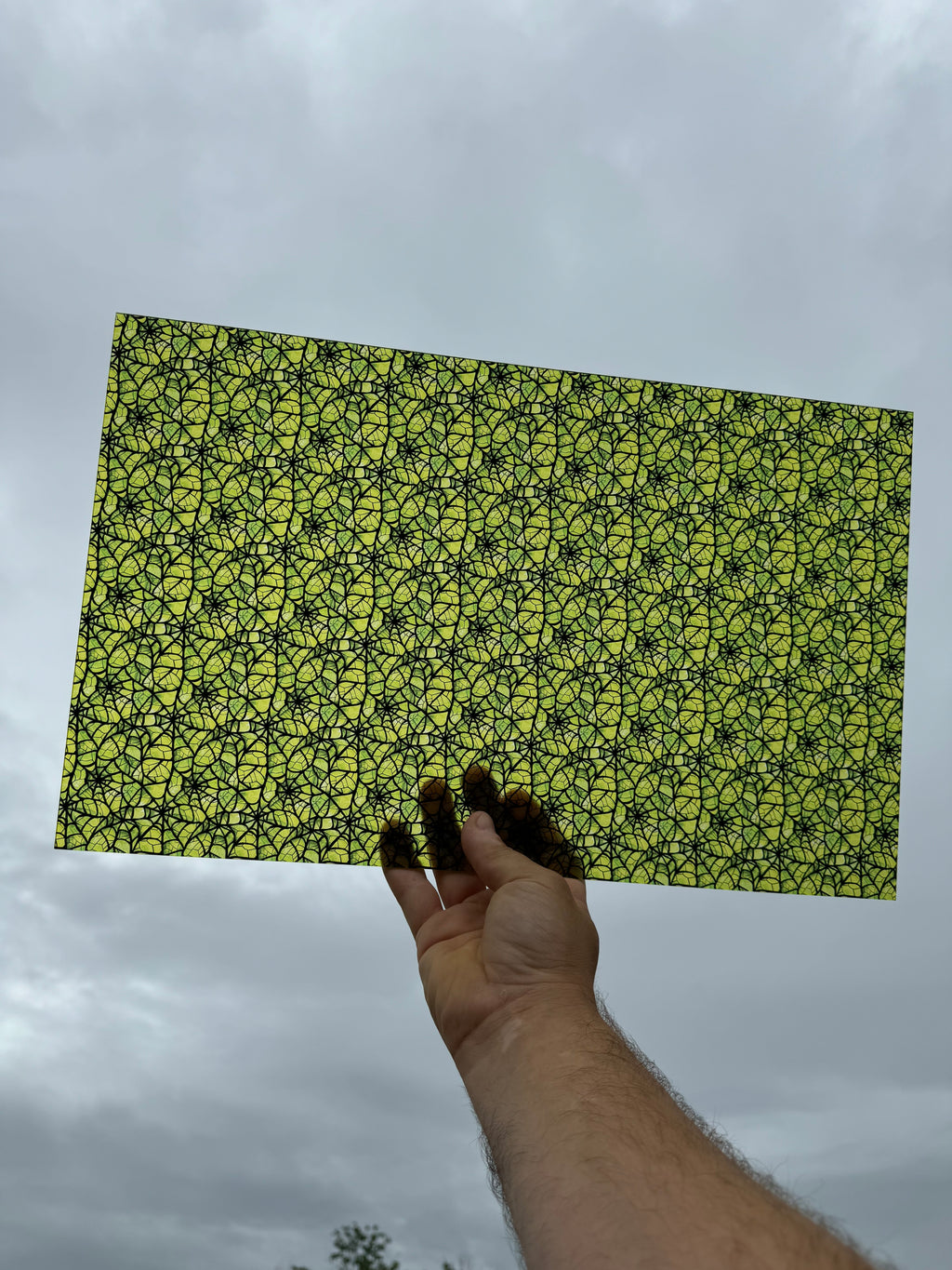 PatternPly® Transparent Green Stained Glass Spiderwebs sheet showing the pattern