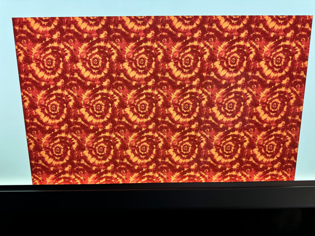 PatternPly® Transparent Maroon and Bronze Tie Dye sheet showing the pattern