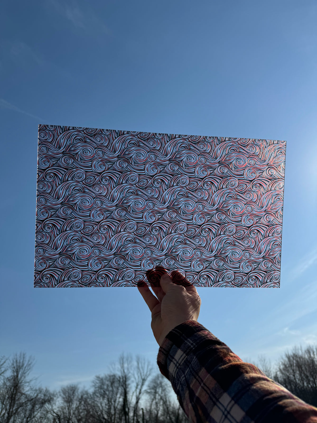 PatternPly® Transparent Red, Black, and White Swirls sheet showing the pattern
