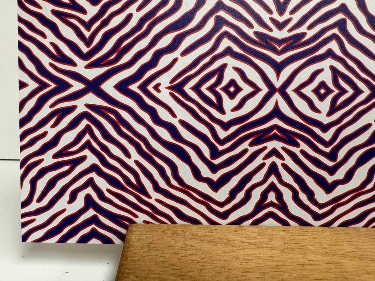 PatternPly® Full Coverage Micro Red White Blue Zebra sheet showing the pattern