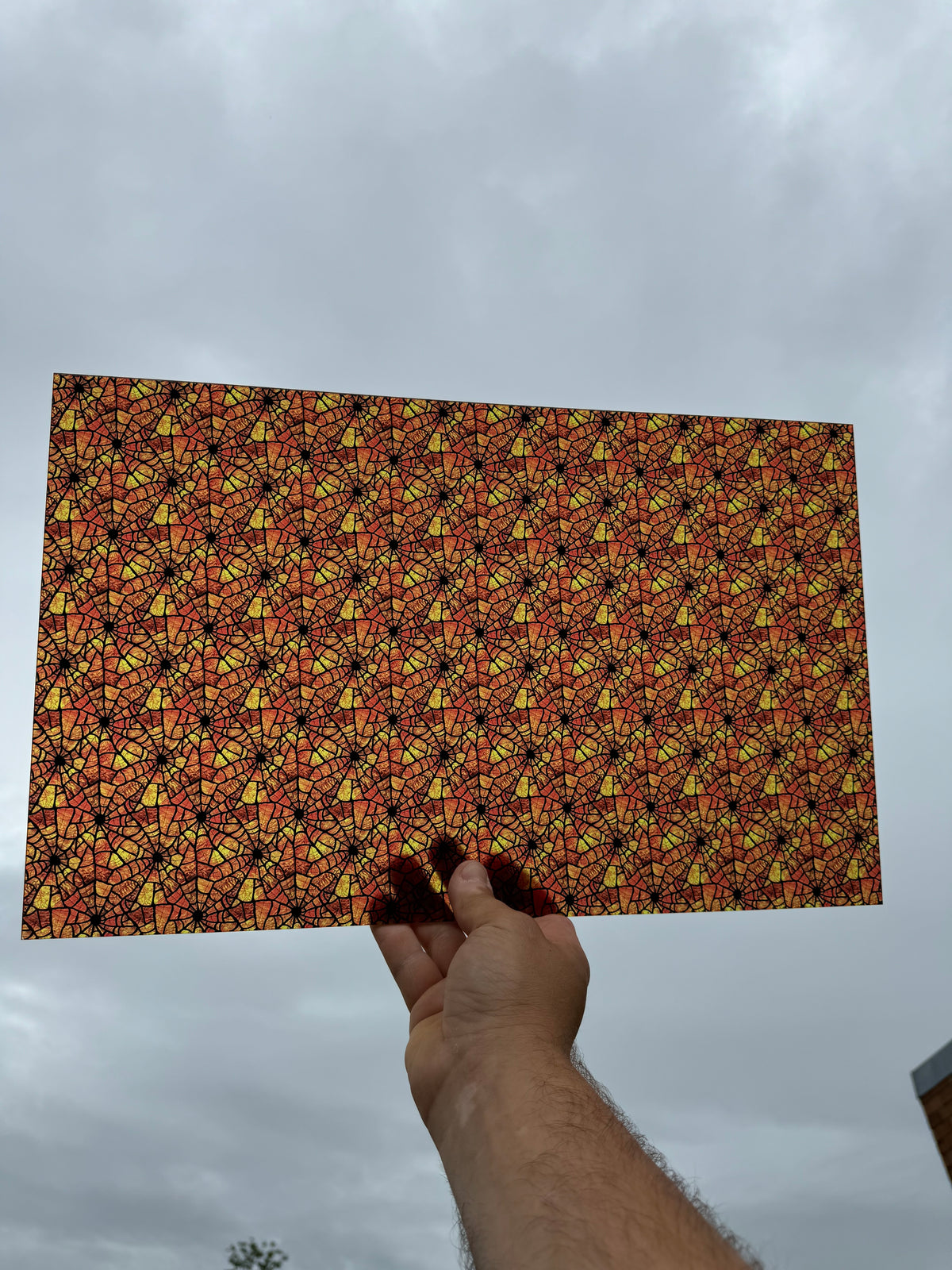 PatternPly® Transparent Orange Stained Glass Spiderwebs sheet showing the pattern