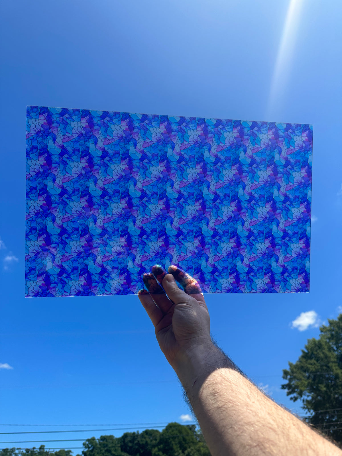 PatternPly® Transparent Blue and Purple Stained Glass sheet showing the pattern