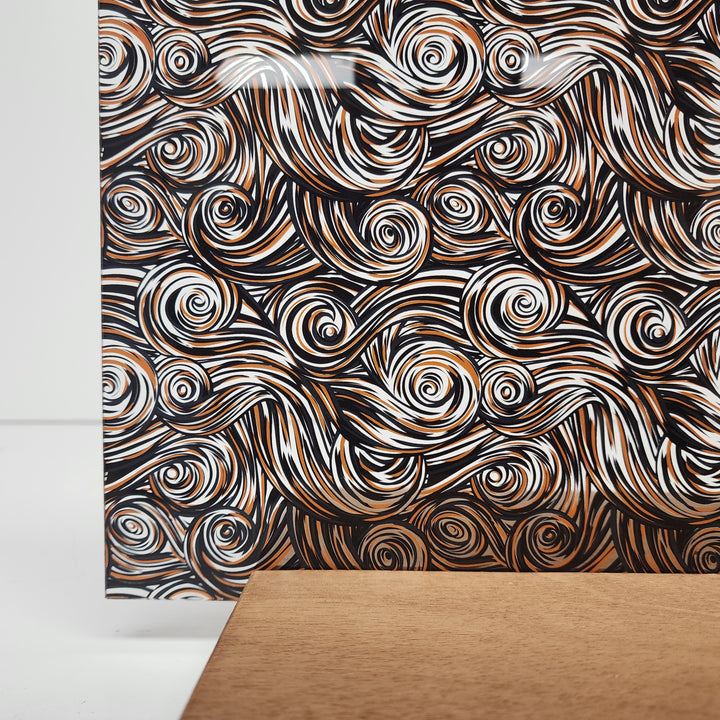 PatternPly® Scattered Black and Orange Swirls