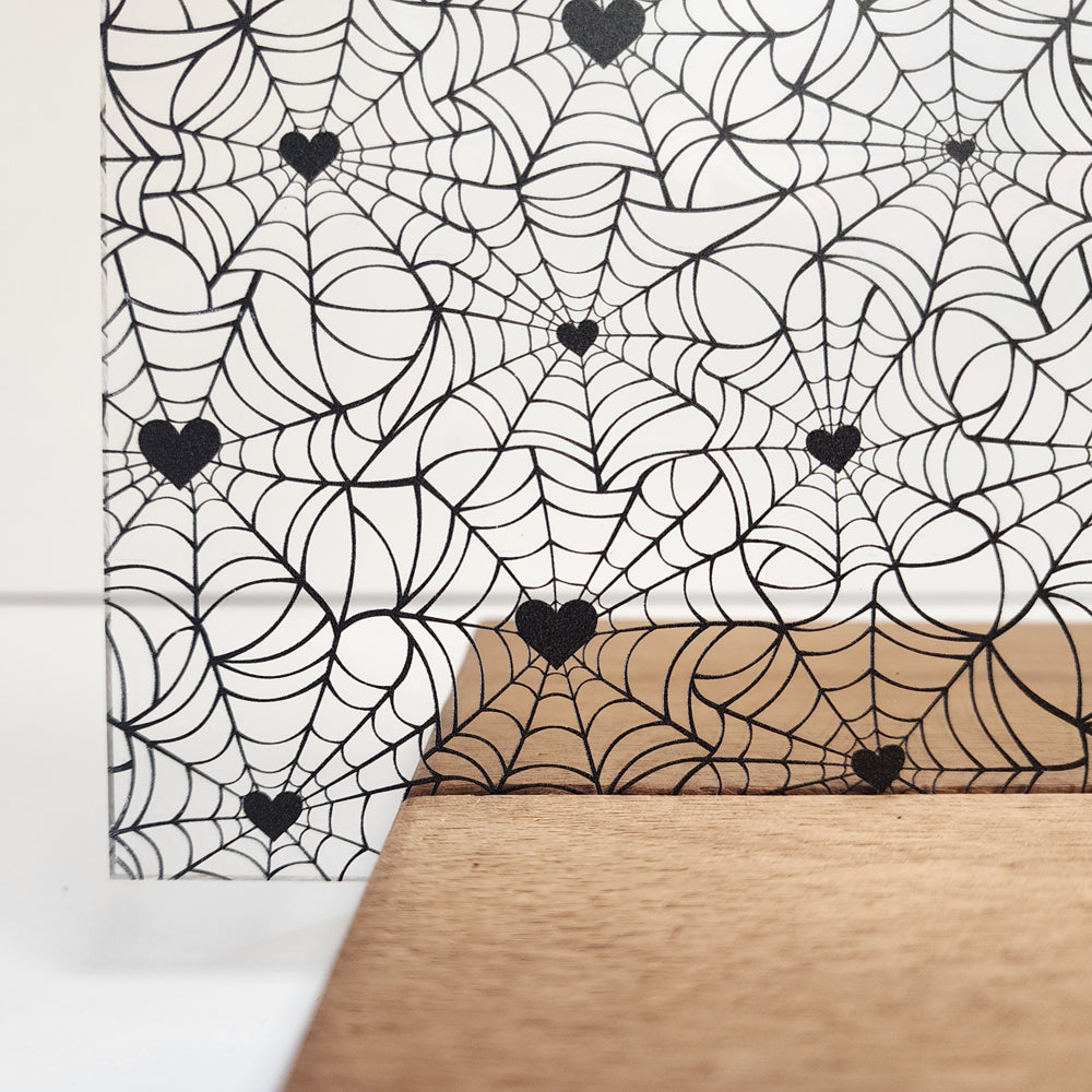 PatternPly® Scattered Black Spiderwebs with Black Hearts sheet showing the pattern