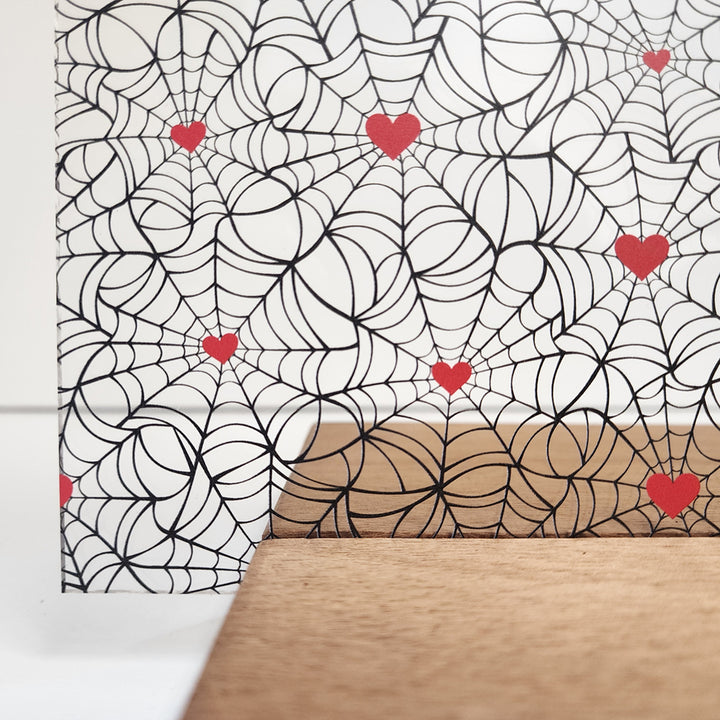 PatternPly® Scattered Black Spiderwebs with Red Hearts