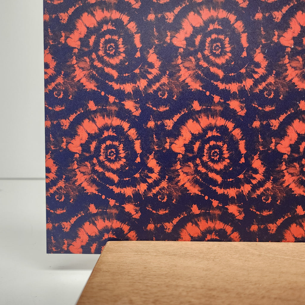 PatternPly® Full Coverage Orange and Blue Tie Dye sheet showing the pattern