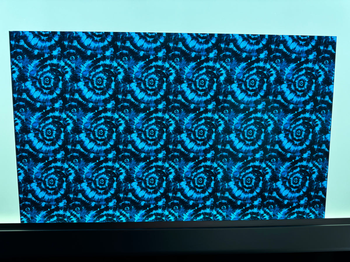 PatternPly® Transparent Blue and Black Tie Dye sheet showing the pattern