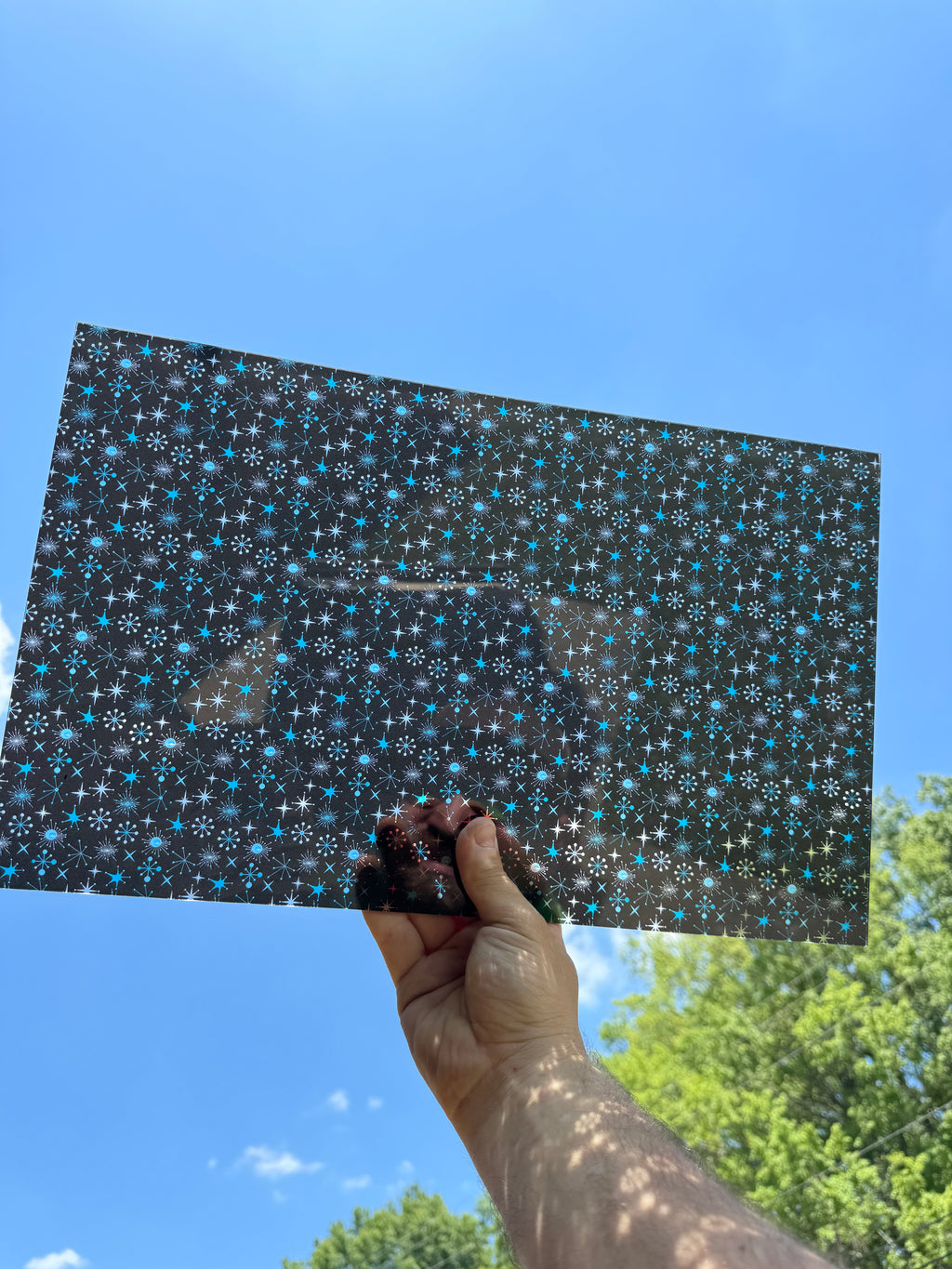 PatternPly® Transparent Mid Century Modern Snowflakes Black Background sheet showing the pattern