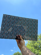 PatternPly® Transparent Mid Century Modern Snowflakes Black Background sheet showing the pattern