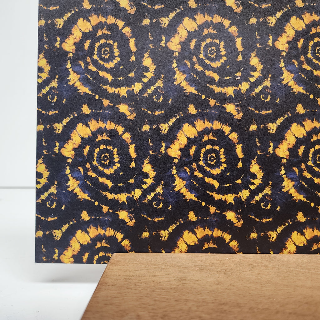 PatternPly® Full Coverage Gold and Black Tie Dye sheet showing the pattern