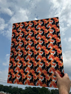 PatternPly® 19x24" Transparent Black and Orange Tie Dye XL Scale sheet showing the pattern