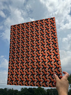 PatternPly® 19x24" Transparent Black and Orange Tie Dye Original Scale sheet showing the pattern