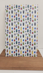 PatternPly® Full Coverage Large Beetles VERTICAL sheet showing the pattern