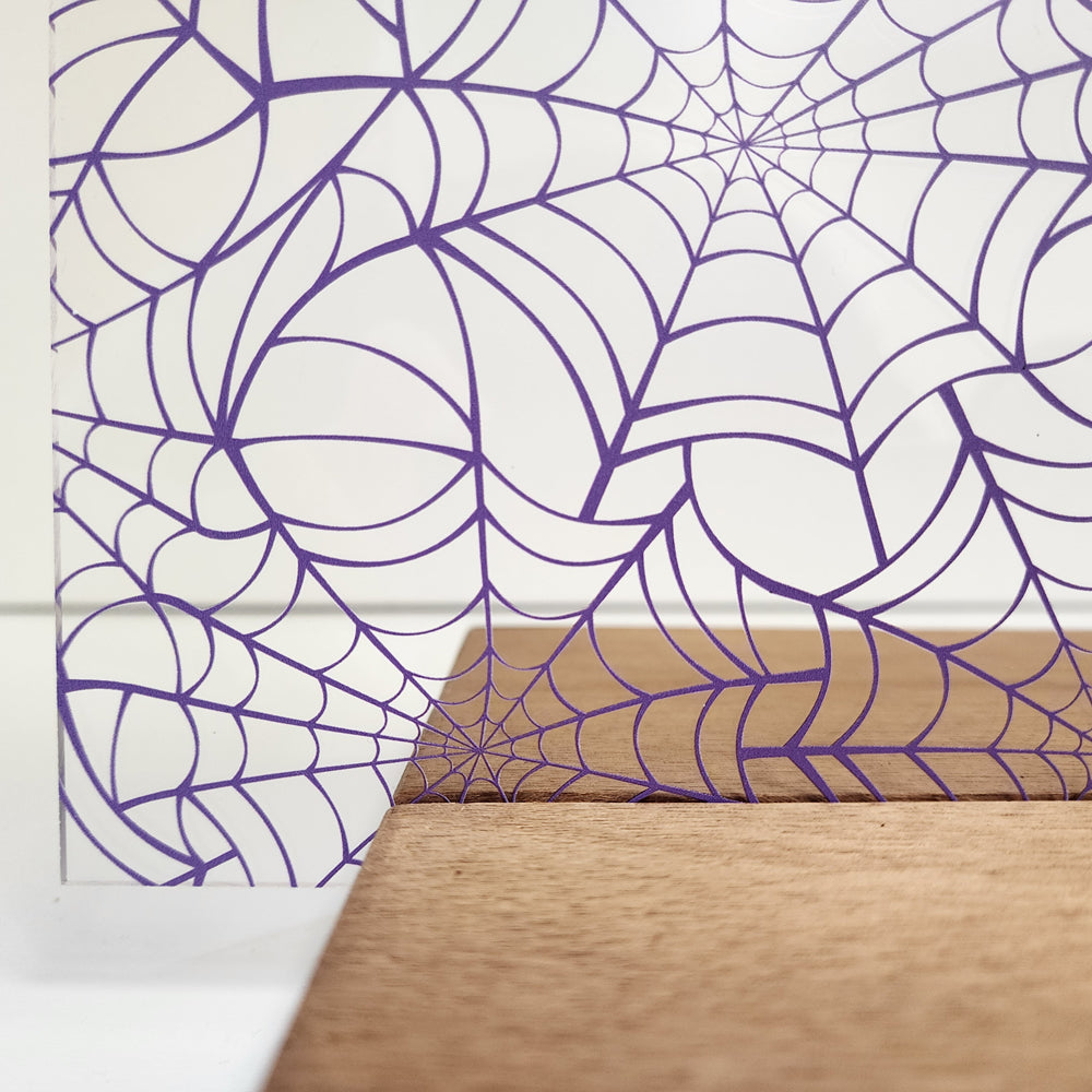 PatternPly® Scattered Purple Spiderwebs Large sheet showing the pattern