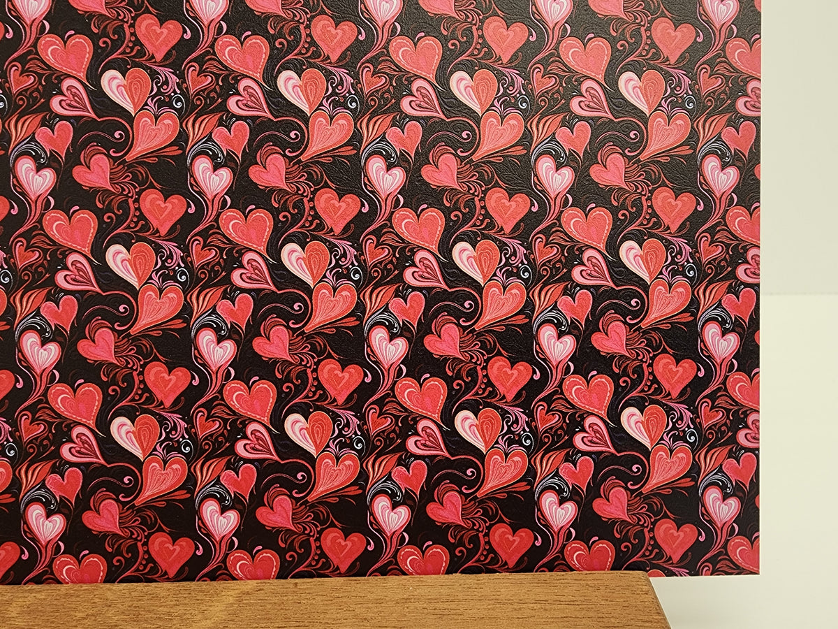 PatternPly® Full Coverage Micro Black and Red Hearts sheet showing the pattern