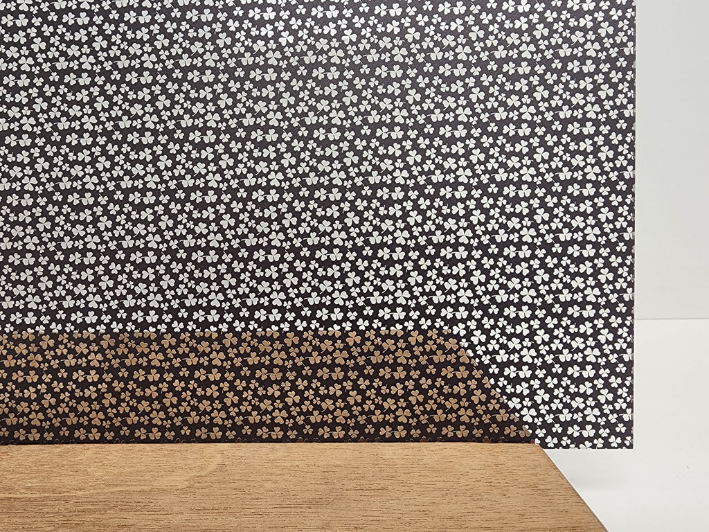 PatternPly® Scattered Micro Shamrocks BLACK sheet showing the pattern