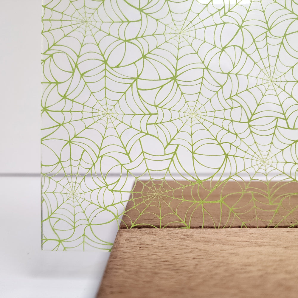 PatternPly® Scattered Green Spiderwebs Mini sheet showing the pattern